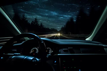 Poster Driving at night highway. Drivers point of view inside car. © serperm73