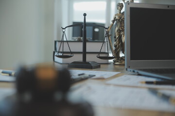 Consultation and conference of Male lawyers and professional businesswoman working and discussion having at law firm in office. Concepts of law, Judge gavel with scales of justice.