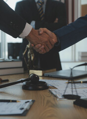 Consultation and conference of Male lawyers and professional businesswoman working and discussion having at law firm in office. Concepts of law, Judge gavel with scales of justice.