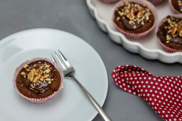 Chocolate walnut muffins served on plate