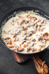 chanterelle julienne mushroom cream sauce fresh tasty meal food snack on the table copy space food background rustic top view 