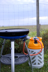 Gas grill, bowl grill for travel and camping, with light weight gas container connected. Gas...