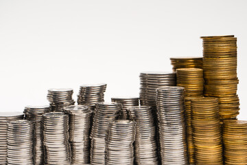 Pile of coins isolated on a white background.