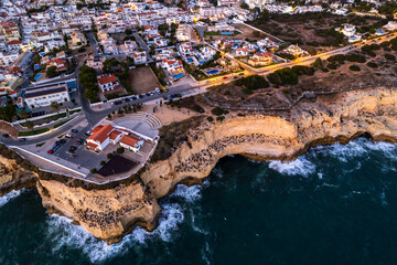 Evening at Carvoeiro popular tourist town in Algarve , Portugal. Aerial drone view