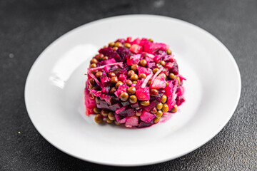 beet salad vegetable green peas, carrot, potatoe, onion, pickled cucumber meal food snack on the table copy space food background rustic top view