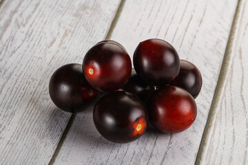 Raw ripe black kumato tomato