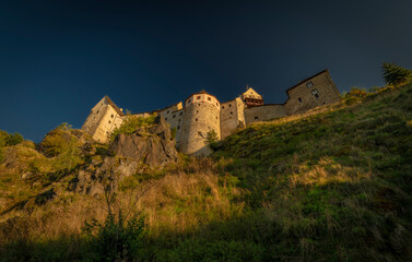 Loket town with castle on hill and river Ohre around in autumn evening