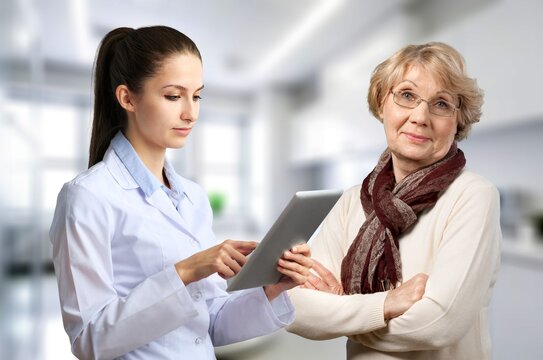 Telehealth concept, senior woman and doctor with tablet computer, AI generated image