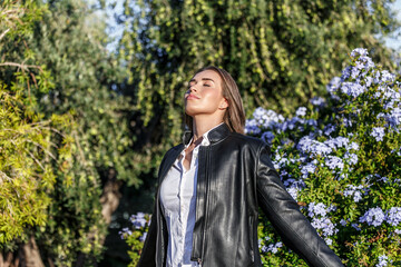 Woman breathing the fresh air of a city park