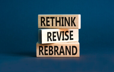 Rethink revise rebrand symbol. Concept word Rethink Revise Rebrand on beautiful block. Beautiful grey table grey background. Business brand motivational rethink revise rebrand concept. Copy space.
