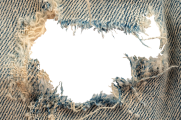 Hole in denim on a white background. Ripped jeans