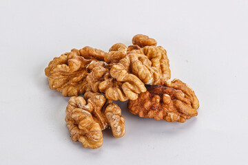 Cracked kernel walnut heap isolated