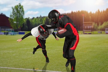 Rugby sporty men training on grass field