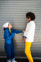 afro mexican man and young woman are laughing together