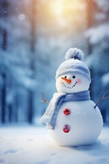Cute snowman in a blue knitted bobble hat and scarf in a winter forest with copy space.