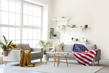 Interior of living room with sofas and USA flag