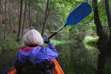 Woman in kayak on Wda river. Kashubia, Poland