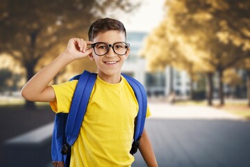 Confident school child standing with backpack, AI generated image