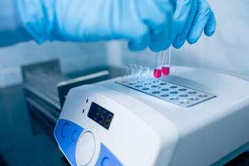 Fototapeta na wymiar Scientist conducts chemical research in a modern laboratory
