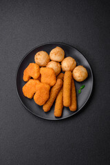Delicious nuggets, sticks and balls of mozzarella and parmesan cheese with salt and spices