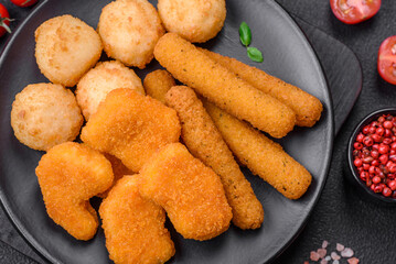 Delicious nuggets, sticks and balls of mozzarella and parmesan cheese with salt and spices