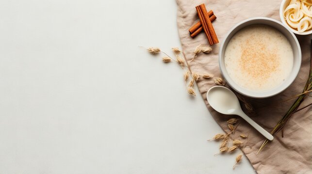  a cup of coffee and a spoon on a napkin with cinnamon sticks.  generative ai
