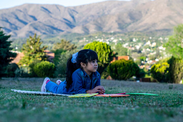 Beautiful latin girl playing in the park.
