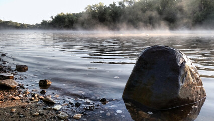 Mist floats down the river