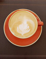 cup of cappuccino coffee on the table