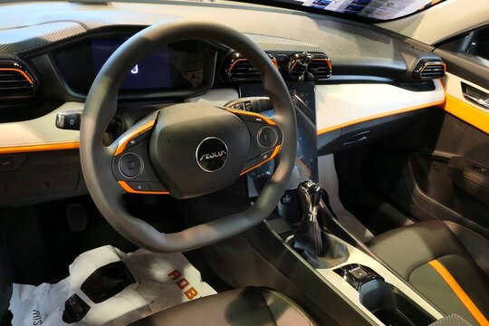 Interior, dashboard and driving wheel of modern mid-size chinese sedan Dongfeng Aeolus Shine, displayed on car expo in Nitra, Slovakia.
