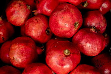 Healthy pomegranate fruit, background, close up top view.
