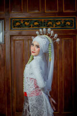 Female fashion model. female makeup model. Asian woman. Indonesian women. wearing white wedding attire. white wedding dress.