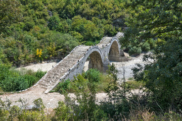 Fototapeta na wymiar Medieval Plakidas Bridge at Pindus Mountains, Greece