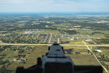 looking down machine gun in rear turret of B-24 bomber while in flight © david