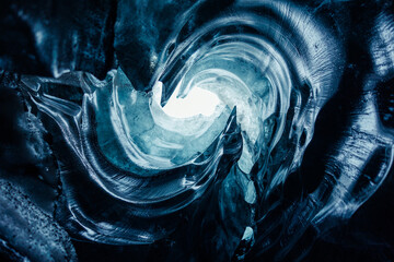 Huge icy blocks inside ice caves, vatnajokull glacier cap with transparent cracked structure in...