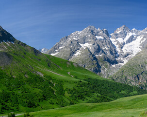 Fototapeta premium Mountains and alpine meadows views near Col du Lautaret, Massif des Ecrins, Hautes Alpes, France in summer