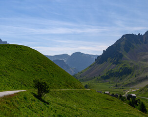 Narrow mountains road from Col de Lautaret to Col du Calibier, Mountains and alpine meadows views...