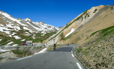 Narrow mountains road from Col de Lautaret to Col du Calibier, Mountains and alpine meadows views...