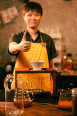 People use coffee making equipment and tools at home kitchens to brew hot coffee that drips into their cups, Professional barista preparing coffee over coffee maker and drip kettle