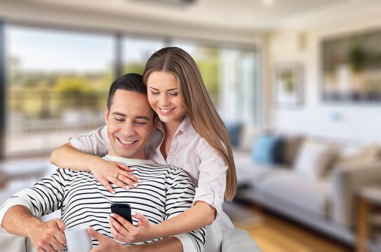 Young happy couple hugging at home, AI generated image
