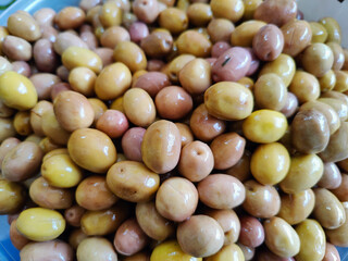 green olives on the market stall, close up