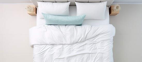 Birds eye view of queen bed with headrest