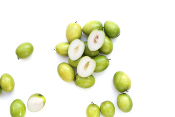 Green jujube fruits on white background.