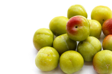 Fresh green plum on white background
