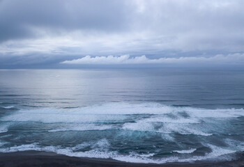 Aerial view of the Atlantic Ocean on a cloudy day near the shore. Sao Miguel island in the Azores