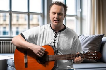 Obraz premium Cheerful young Student man Playing Guitar, AI generated image