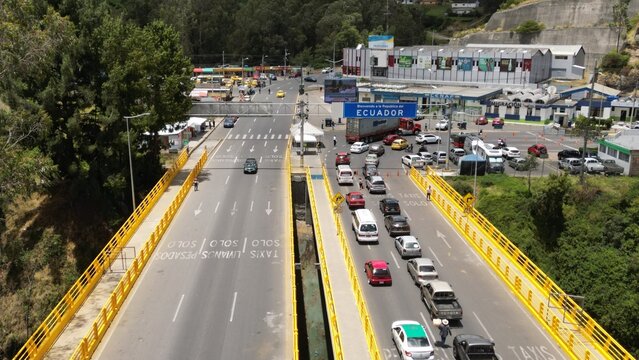 IPIALES, COLOMBIA - October 3, 2023: some cars driving through the migration checkpoint in the border line between Colombia and Ecuador, aerial shot