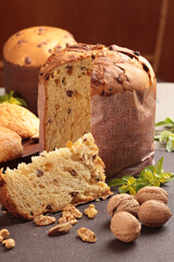 Delicious Panettone and slice with candied fruits, nuts and chestnuts