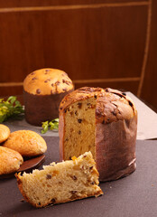 Delicious Panettone and slice with candied fruits, nuts and chestnuts