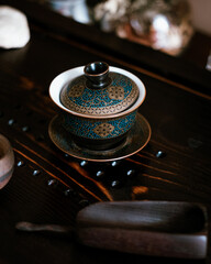 Gaiwan on a wooden chaban. Chinese tea ceremony.